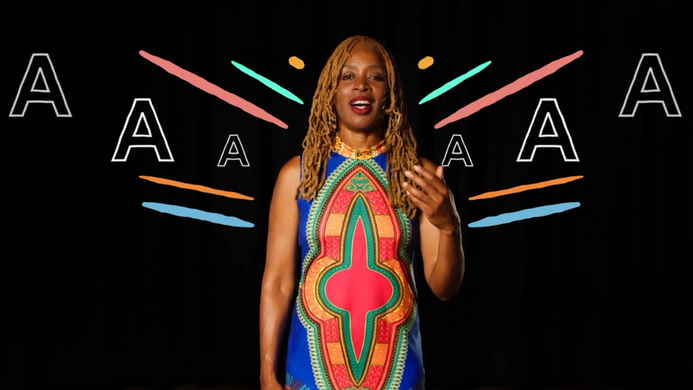 JB Rose singing to camera, illustrations of colourful lines and the word 'Aaah' are around her