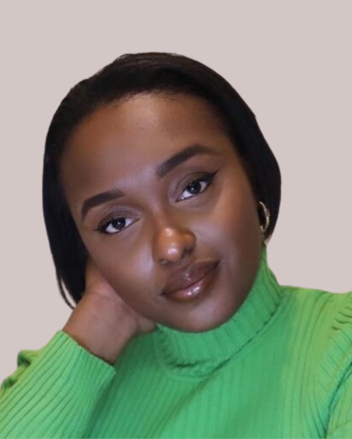 a photo of Yasmin Joseph wearing a green jumper on a beige background