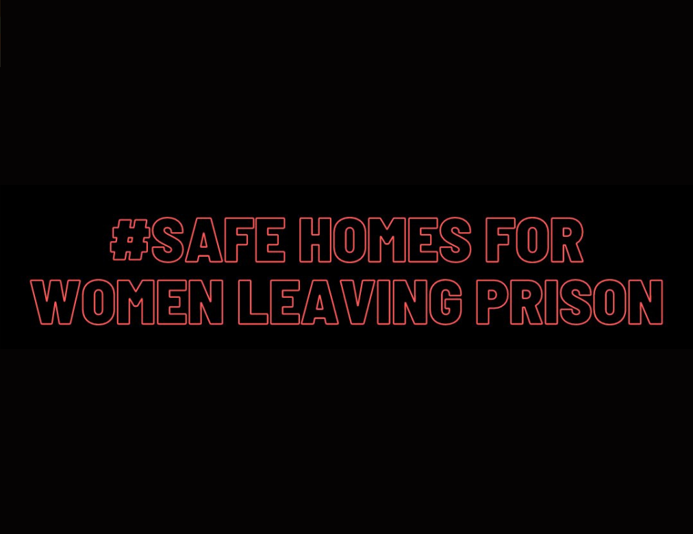 a black back ground with the words # safe homes for women leaving prison in red text