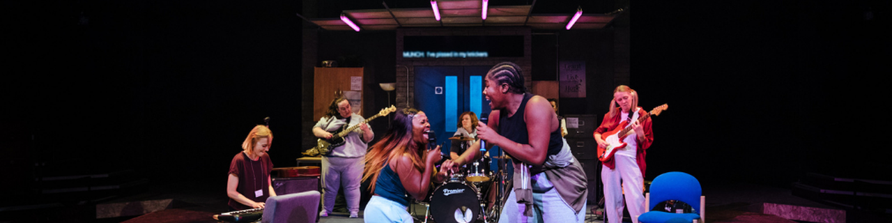 The cast of Typical Girls on stage at the Sheffield Crucible Theatre performing the song "Shoplifting"