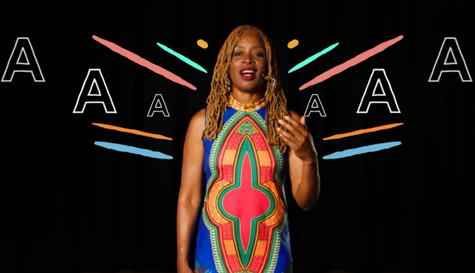 JB Rose singing to camera, illustrations of colourful lines and the word 'Aaah' are around her