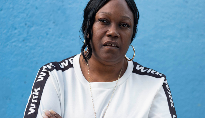 A photo of Jennifer Joseph against a blue wall
