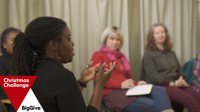 women at a Clean Break workshop sat on chairs in a circle, the Big Give logo in the corner