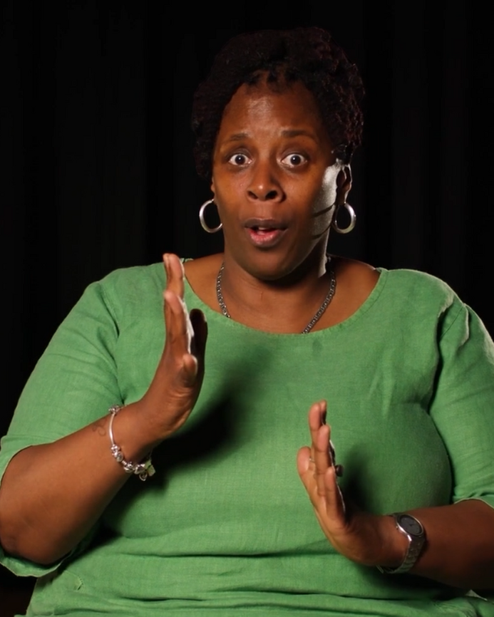 a screenshot of tracey anderson talking to the camera, an illustration of a boiling pot is in the corner