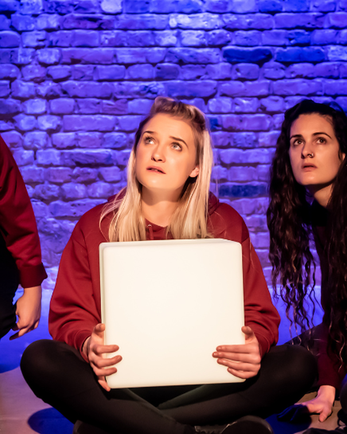 three young artists performing in Inside This Box