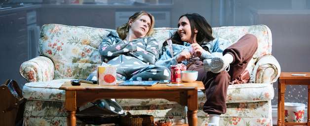 a photo from our play Dixon and Daughters, two women are sitting on a sofa and talking