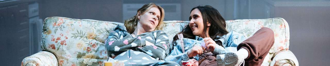 a photo from our play Dixon and Daughters, two women are sitting on a sofa and talking