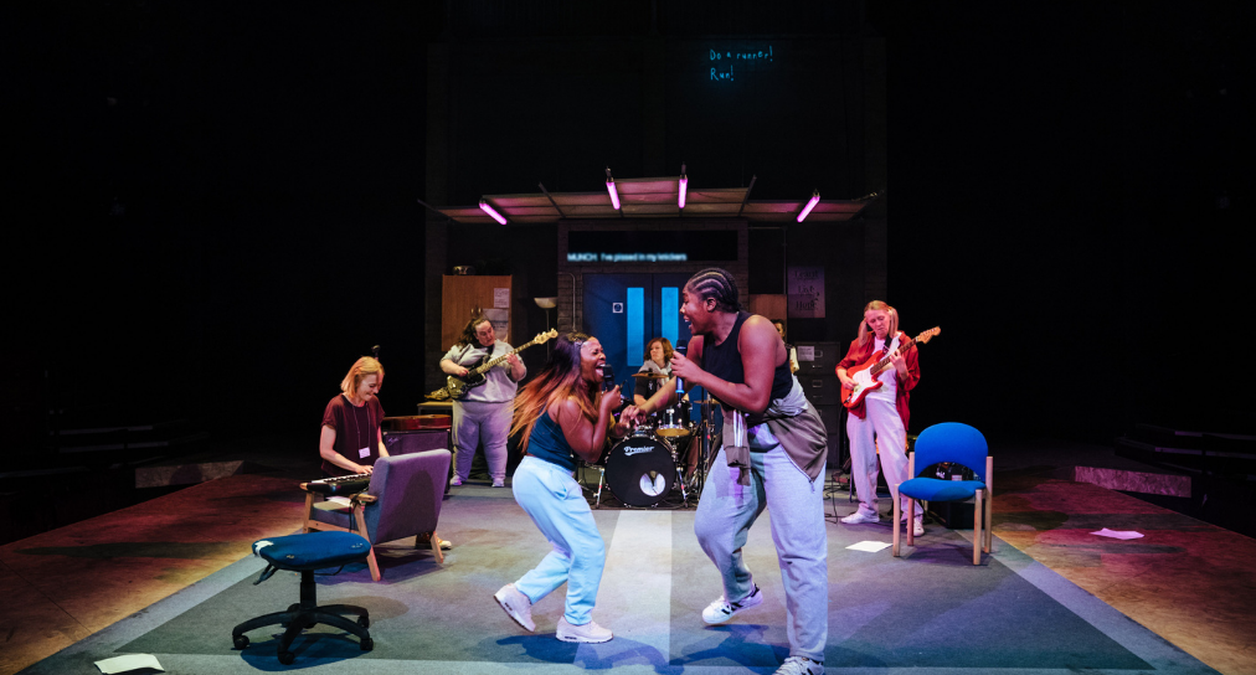 The cast of Typical Girls on stage at the Sheffield Crucible Theatre performing the song "Shoplifting"