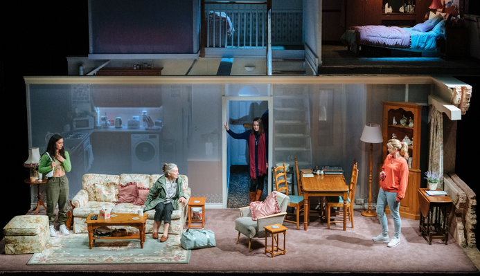 a photo of the set of Dixon and Daughters which is a 2 story house