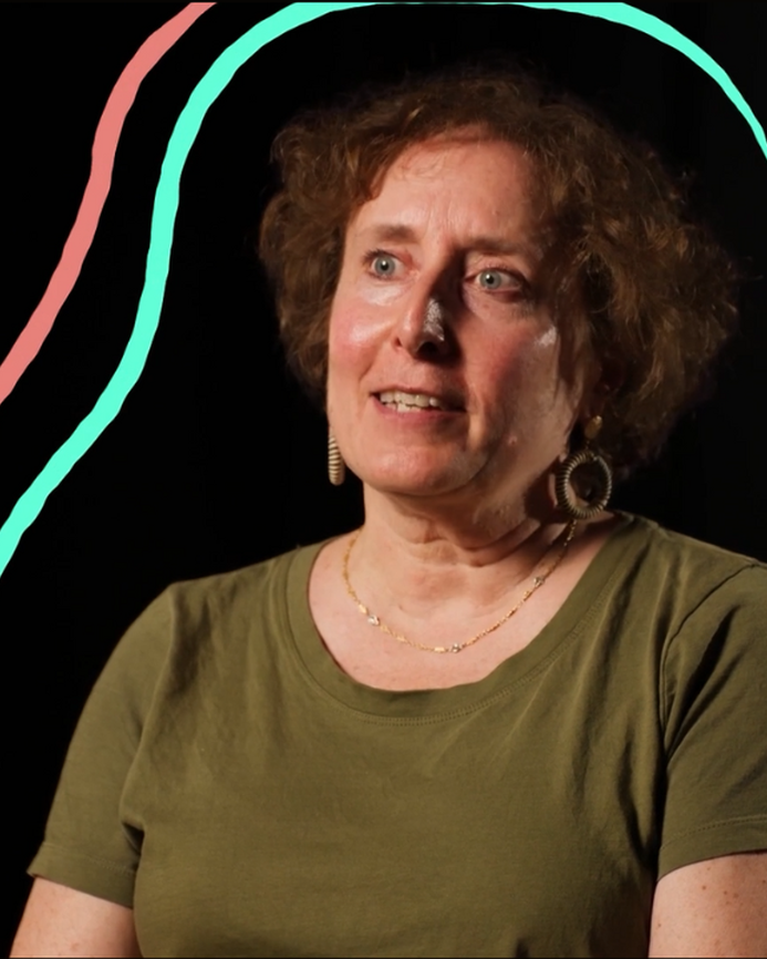 a screenshot of Anna talking to the audience, there are colourful illustrated lines around her head