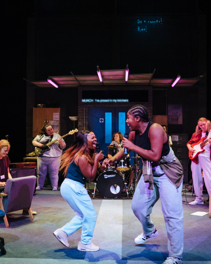 The cast of Typical Girls on stage at the Sheffield Crucible Theatre performing the song "Shoplifting"
